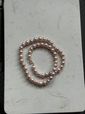 Genuine fresh water soft pink pearls 14k ends