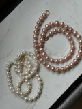 Genuine fresh water peachy pink pearls 14k ends