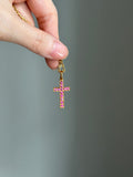 18k cross with natural pink rubies