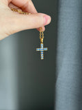 18k cross with natural blue sapphires
