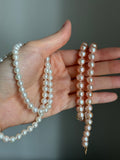 Genuine fresh water peachy pink pearls 14k ends