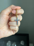 18k cross with natural blue sapphires