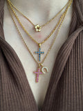 18k cross with natural pink rubies