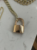 14k rosy working padlock in with dark blue (almost black) sapphire