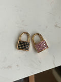 14k rosy working padlock in with dark blue (almost black) sapphire