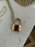 14k rosy working padlock in with dark blue (almost black) sapphire